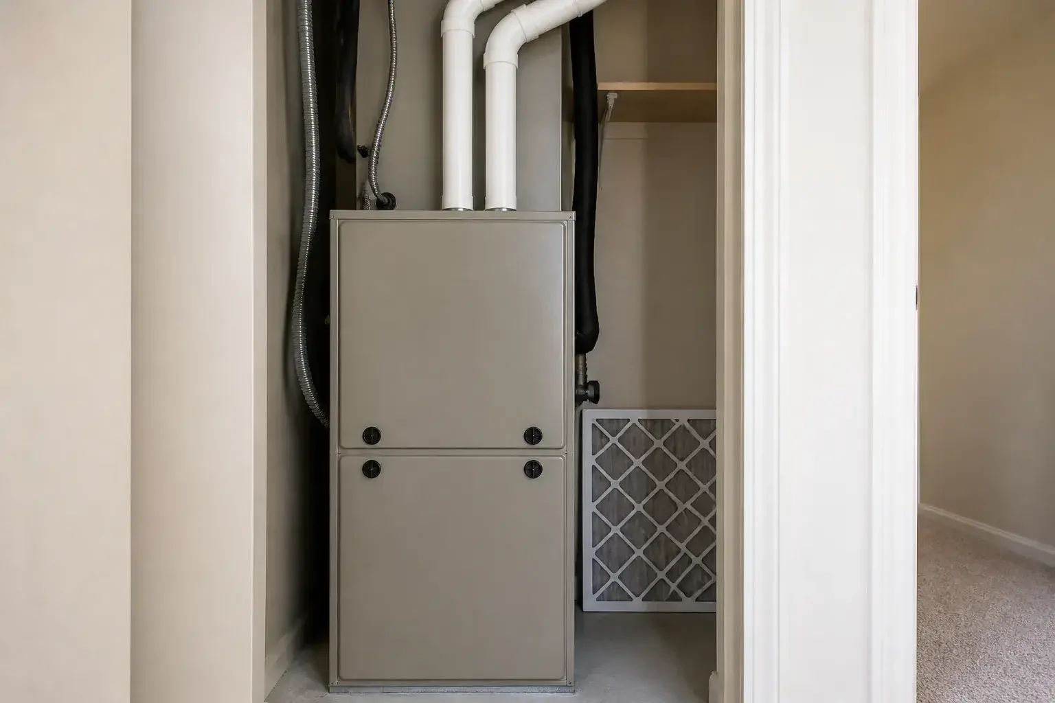 Finished furnace repair in a tidy mechanical closet.